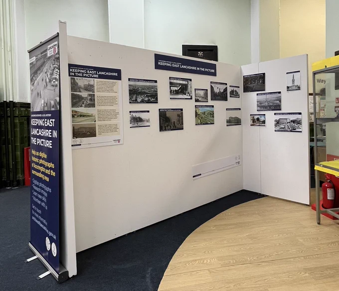 2 colour photographs showing images on display on the exhibition boards in the library