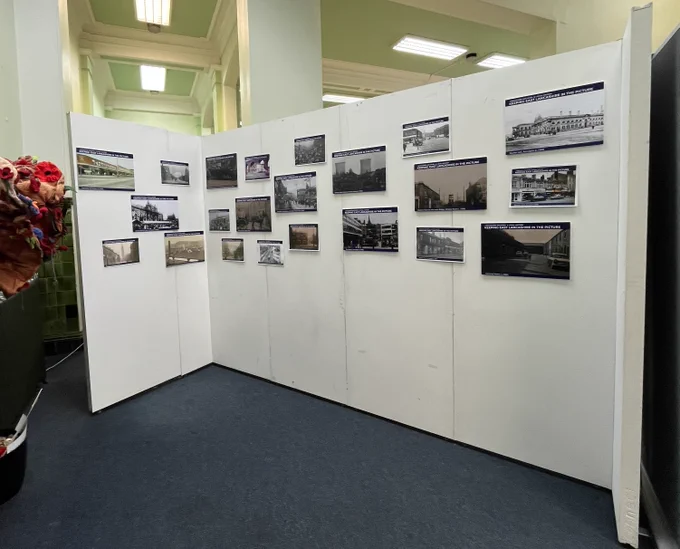 2 colour photographs showing images on display on the exhibition boards in the library