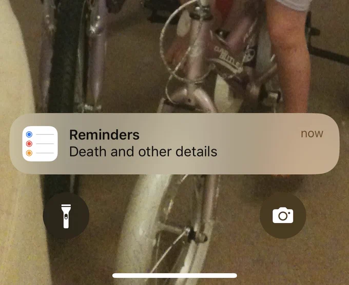 Reminder notification from a phone Home Screen that says ‘Death and other details’