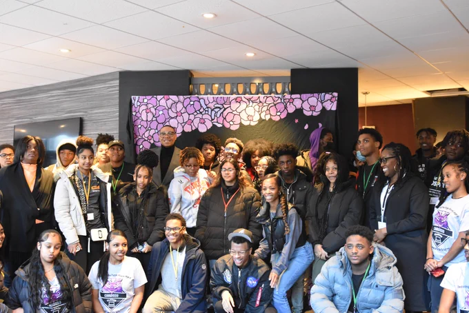 Chancellor Ferebee poses for a photo with over twenty students.
