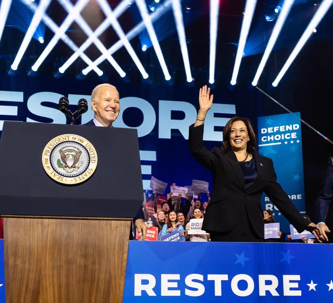 President Joe Biden and Vice President Kamala Harris waving at the crowd during a reproductive freedom event 