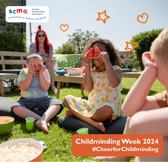 Picture of 3 children sitting outside on the grass with food having fun with an adult watching from a distance.  Text reads: Childminding Week 2024 #cheerforchildmining