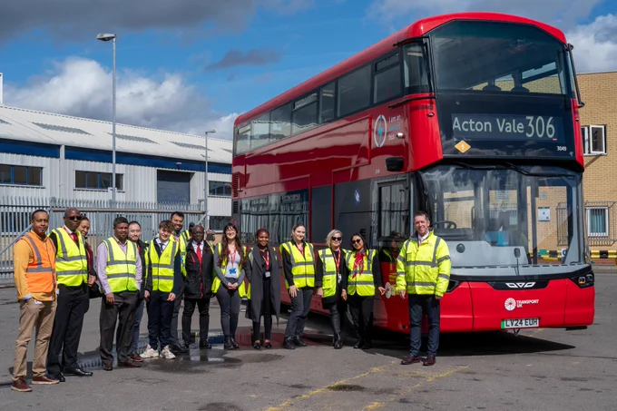 Transport UK London Bus team at Battersea depot with a route 306 Wrightbus Electroliner
