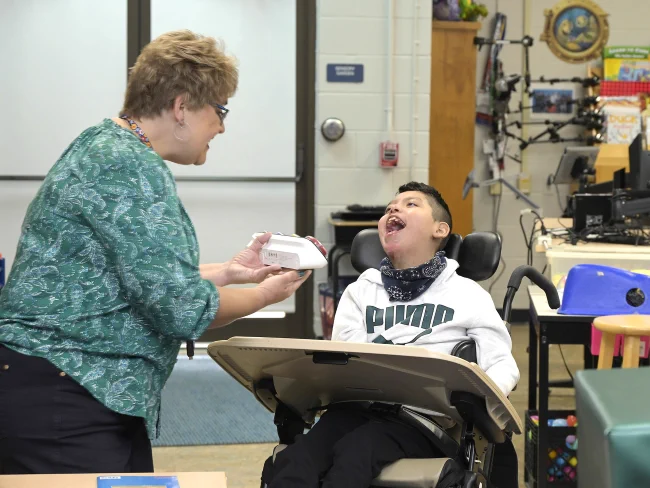 Leigh Ann Harbort with Harris-Hillman student in class.