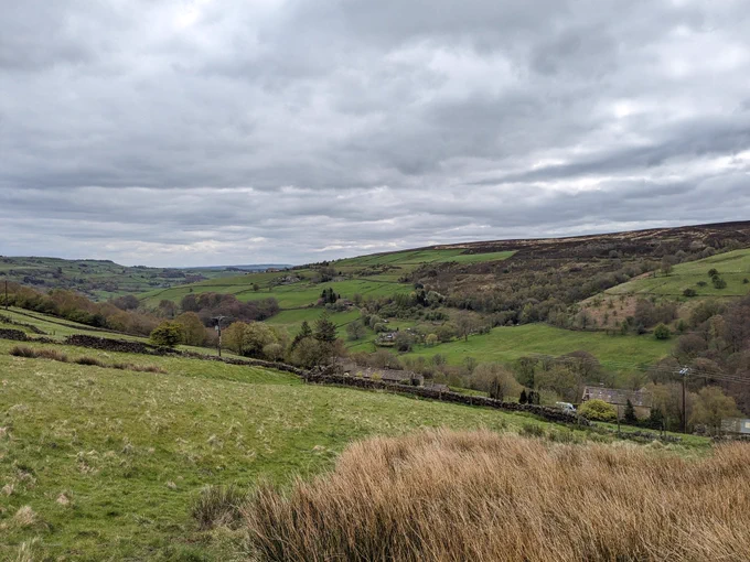 A photo of a green valley with lots of fields