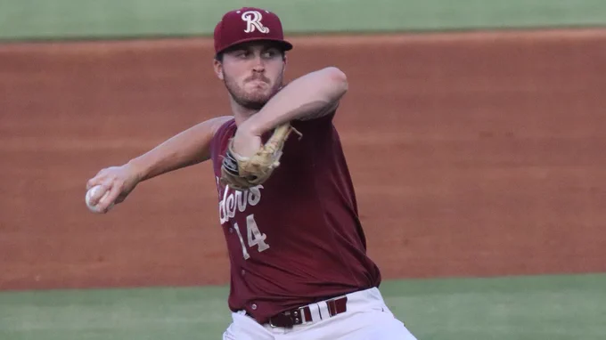Dane Acker pitches in a red Frisco RoughRiders jersey