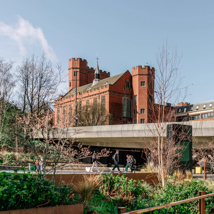 Firth Court in the distance, the concourse, students and greenery in foreground