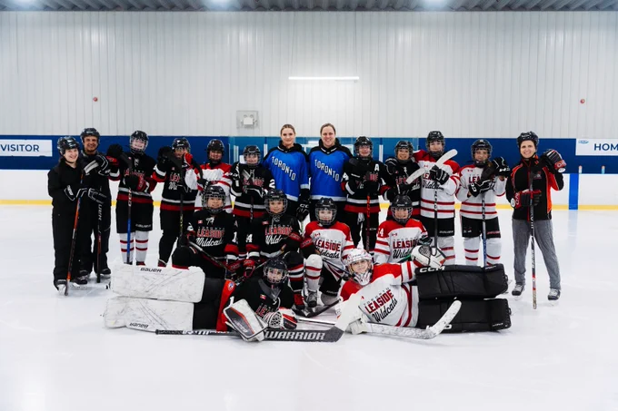 Olivia Knowles and Lauriane Rougeau pose for a group photo with the Toronto Leaside Wildcats U13A Team.