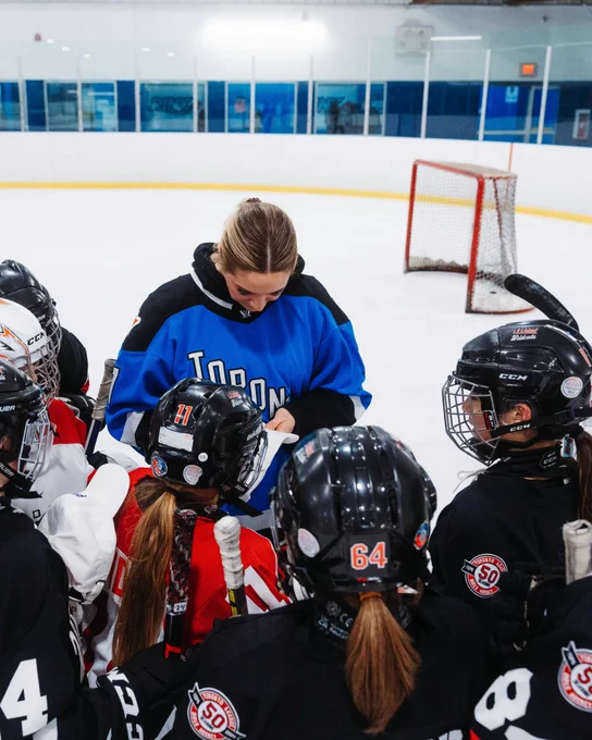 Olivia Knowles signing autographs for the Toronto Leaside Wildcats.
