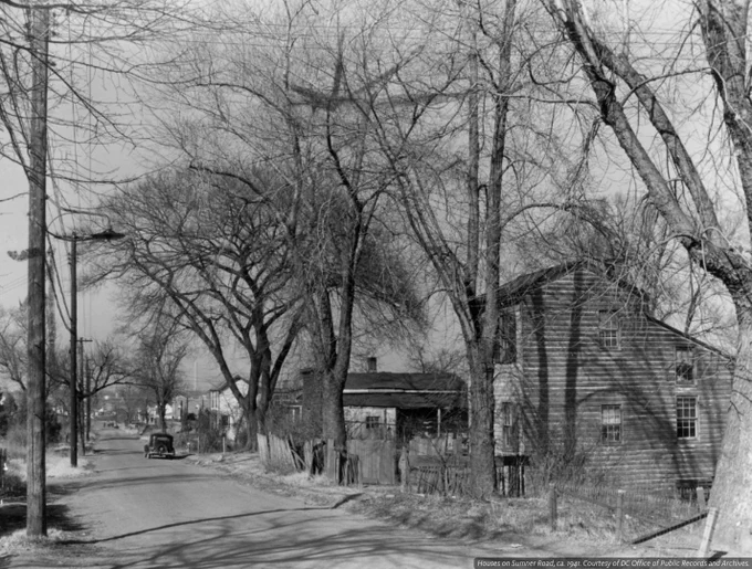  A black and white photo on the street of houses on Summer Road.
