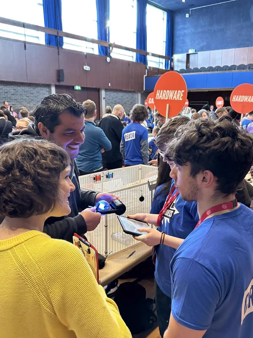 Young people at Coolest projects showing their robots project to the judges