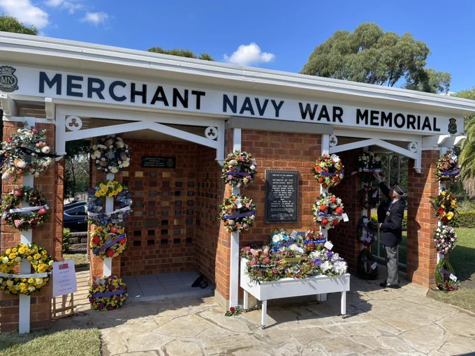 Photo of the Merchant Navy War memorial at Rockwood cemetery. Wreaths are laid in commemoration.