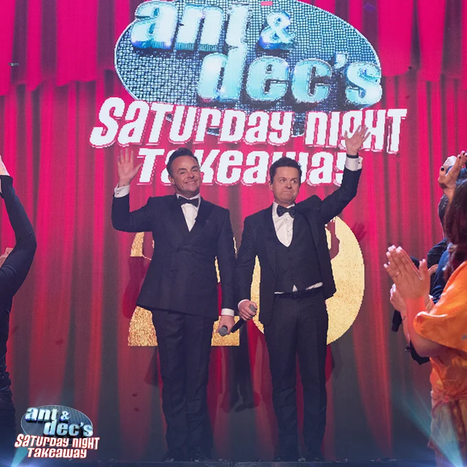Ant and Dec stood at the top of the SNT stage waving