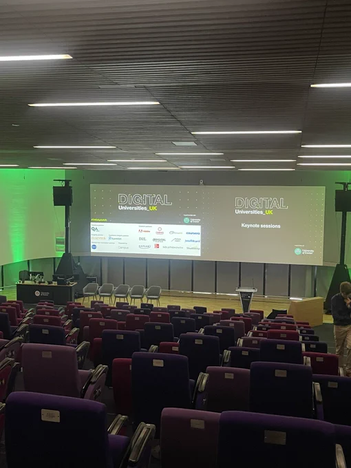 Empty auditorium with presentation on the screen.