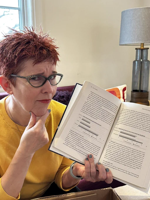 Me holding my book, Sex in Canada.