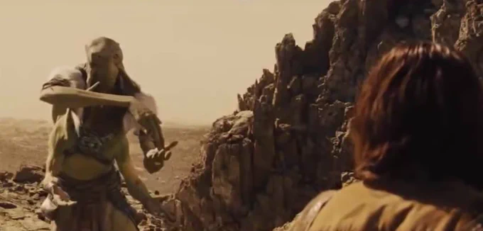 Scene from John Carter movie where the alien is gesturing to him JUMP