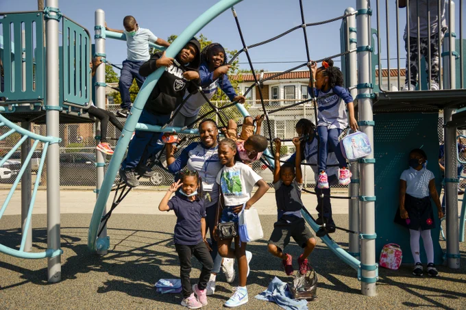 Children playing on playground equipment