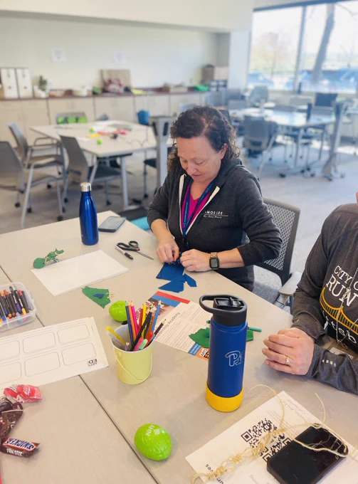 Participant makes a doll as part of a storytelling workshop.