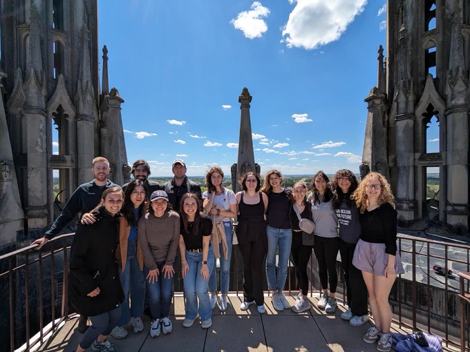 group of people standing together on landing at top of Duke Chapel
