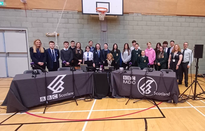 Staff and pupils from Port Glasgow High, St Stephen's High and Craigmarloch School with BBC Radio Scotland presenter Kaye Adams