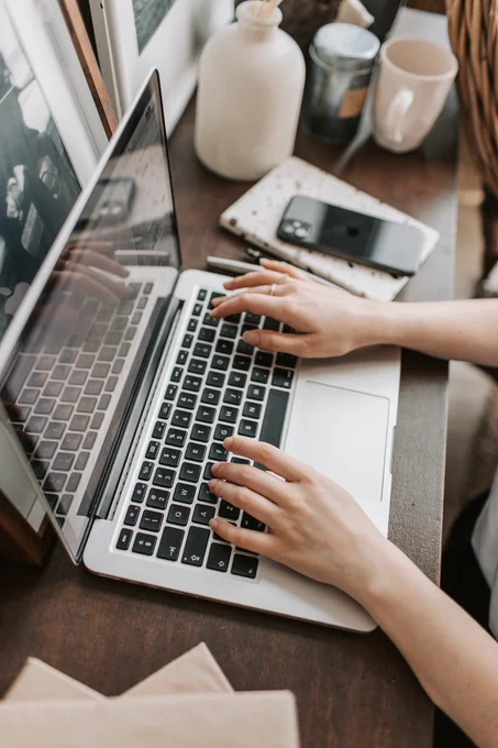 Person typing on a laptop