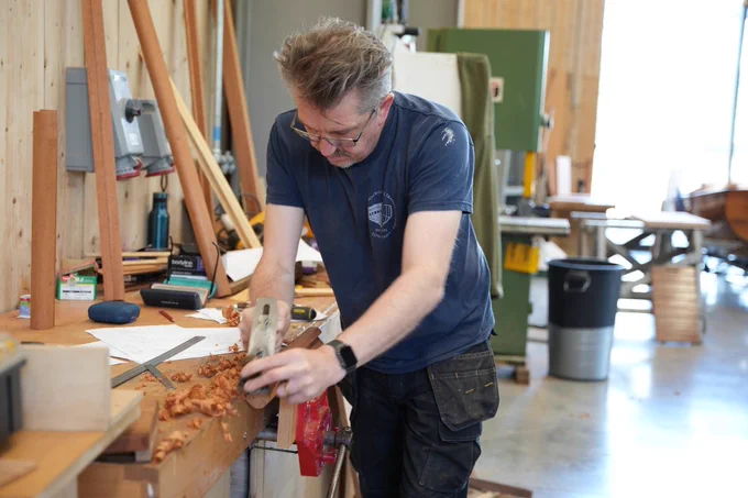 Conservation team member working in the Conservation Workshop at Windermere Jetty Museum. Photo credit: Natasha Suriya.