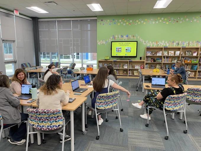 AFES staff learning AI tools during a PD training.