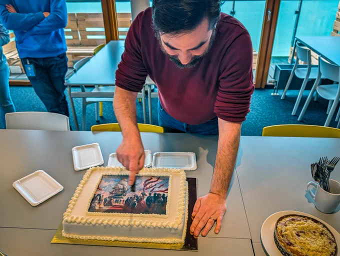 Our senior producer is cutting one of the Anno cakes.