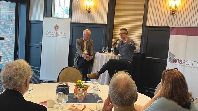 Ezra Klein sits with Jeff Mayers in front of an audience