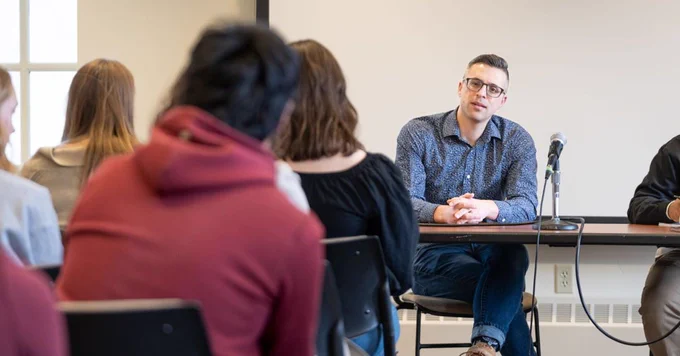 Ezra Klein talks to students in a classroom