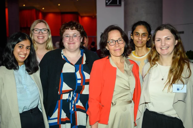 A group of smiling CAIDE staff and PhD candidates at the Science Gallery