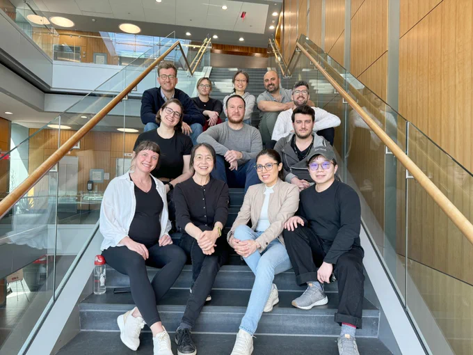 Picture of the Wu lab members sitting on a staircase.