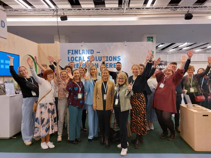 The group of people in the expo stand. 