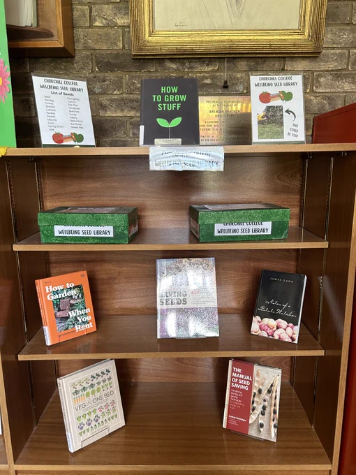 A display of books related to growing and gardening. Churchill Library seed boxes for students to use.