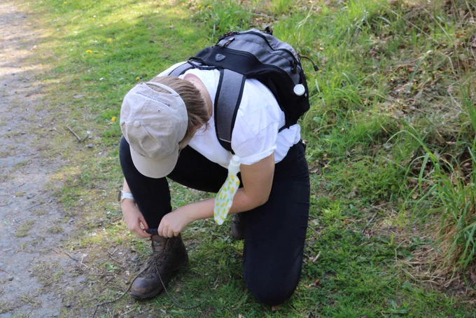 Young person fix their shoe