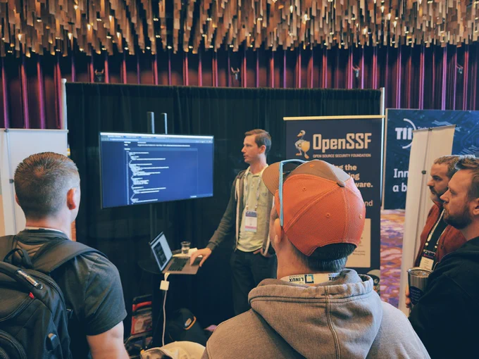 OpenSSF conference booth with a live demo