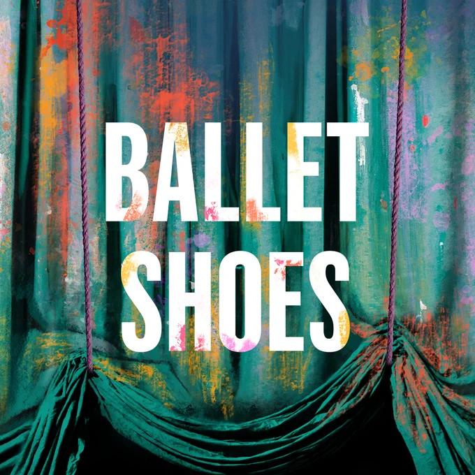 'Ballet Shoes' is written in white writing. Behind it it a blue curtain covered in multi-coloured paint splatters. Two red ropes begin to raise the curtain from the bottom.