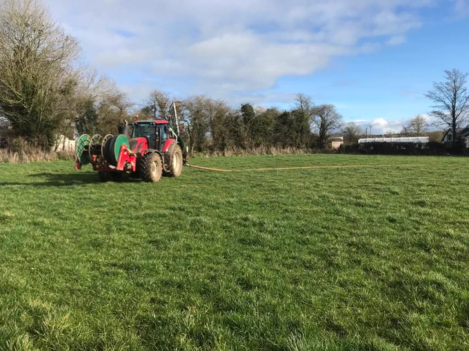 The tractor in this picture is getting ready to apply cattle slurry with a band spreader on an umbilical system where the slurry is pumped directly from the house to the field. The cattle slurry was generated by the cows during the winter. “We try to spread it on the fields as early as possible to promote spring grass growth and to minimise methane emissions associated with slurry storage. Essentially, we are recycling the nutrients harvested in silage last year, and fed to cows while they were housed”, says Humphreys. Photo: James Humphreys. 
