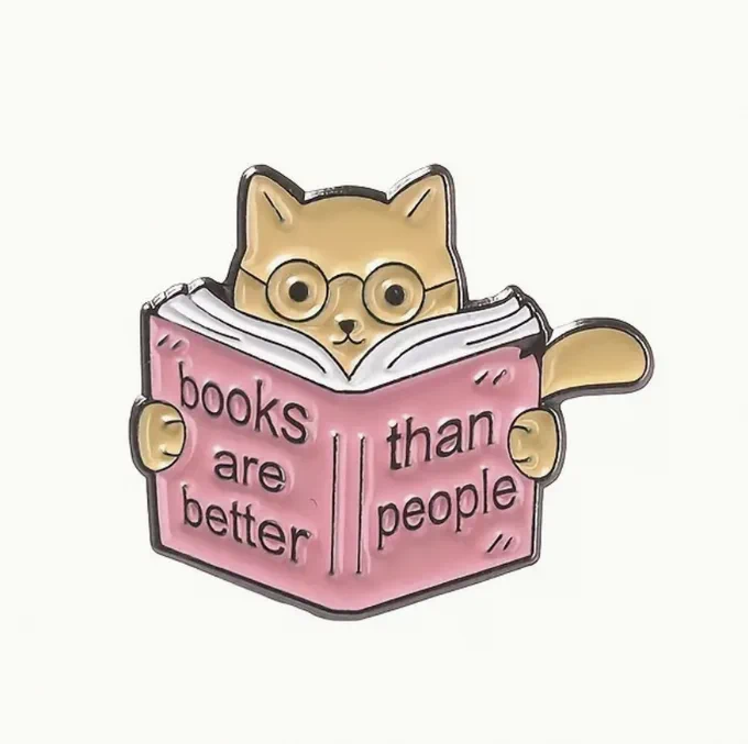 Cat badge that says "Books are better than people."