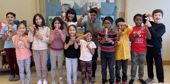 Students showing off their candy DNA molecules- before eating them!
