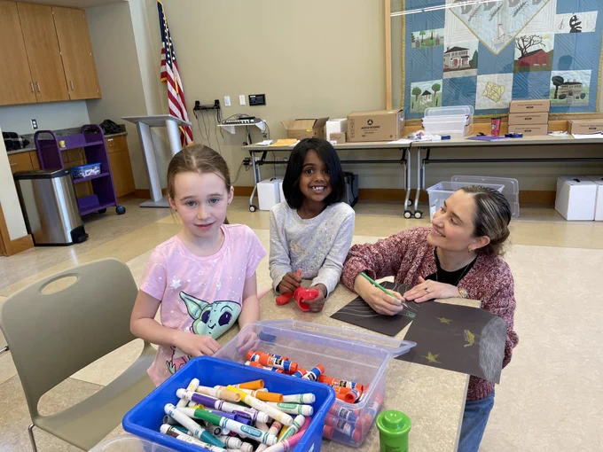 Students at the creation station bring their ideas to life with Leonora Martinez-Nunez, PhD.