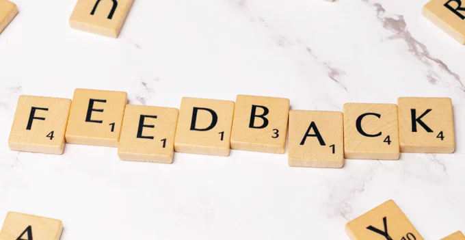 Image of board game letters spelling out the word 'FEEDBACK'