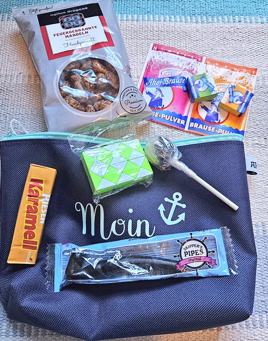 Small bag with assorted German treats and a small game