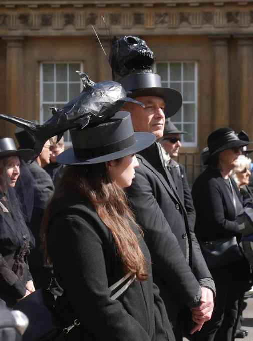 TV presenters and campaigners, Chris Packham and Megan McCubbin standing side by side, dressed in black. 