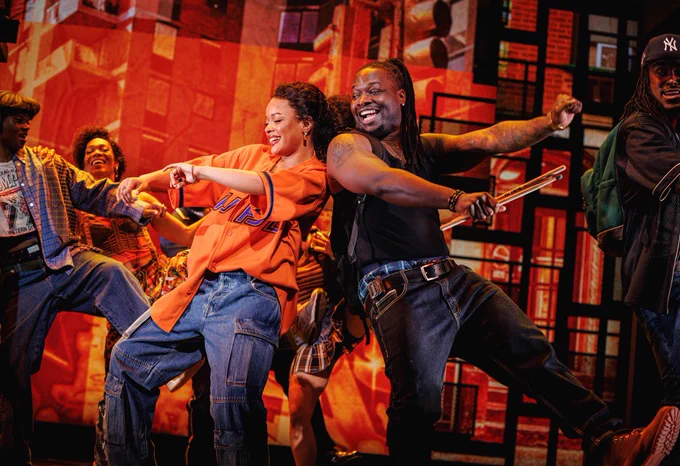 On-stage scenes from the Broadway Musical Hell’s Kitchen featuring actors singing dancing with street style clothes and colorful lights.