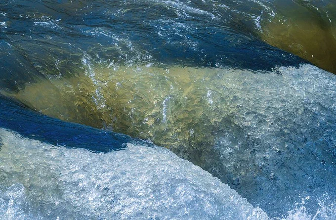 Frozen motion of water flowing over waterfall