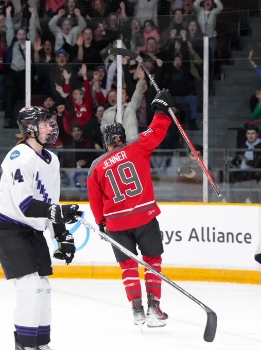 Brianne Jenner celebrating her hat trick goal. She is wearing her red PWHL Ottawa uniform.