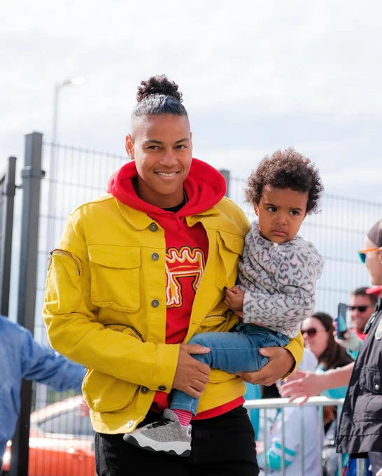 Franch and daughter Kamari walking into the stadium