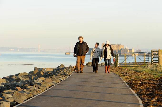 Photo of a family walking along a path on the John Muir Way. Image credit: Lorne Gill/NatureScot