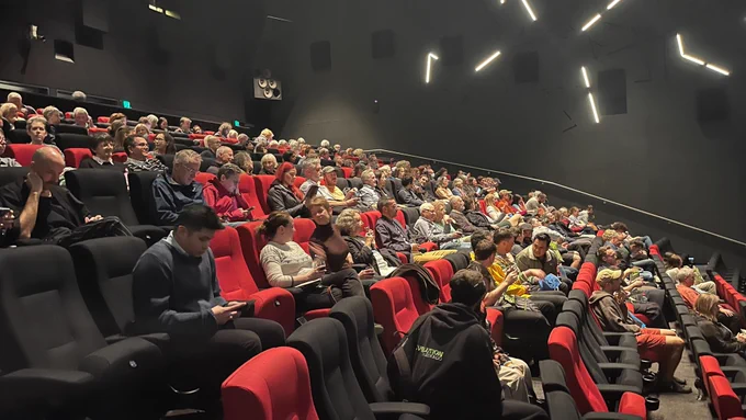 Lots of audience members in a cinema